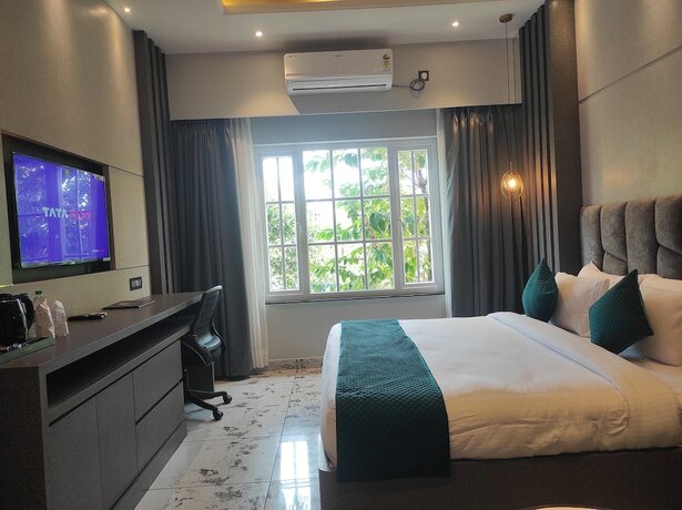 Imagen de la habitación del Hotel HM Resort, Dibrugarh. Foto 15