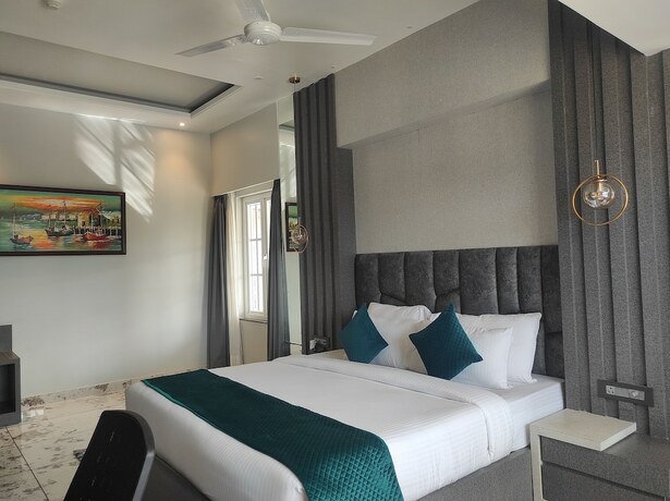 Imagen de la habitación del Hotel HM Resort, Dibrugarh. Foto 18