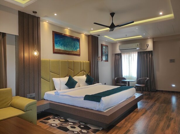 Imagen de la habitación del Hotel HM Resort, Dibrugarh. Foto 19