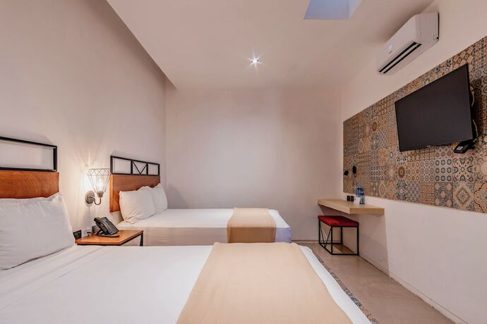 Imagen de la habitación del Hotel HO Merida. Foto 18