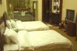 Imagen de la habitación del Hotel HONG FENG. Foto 4