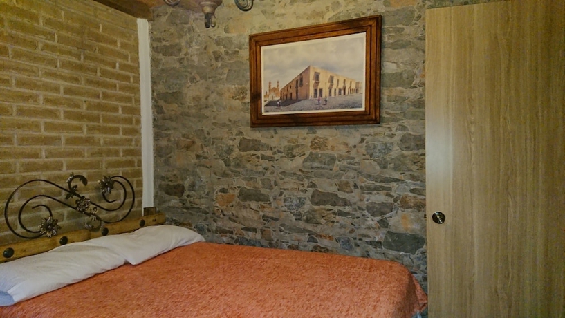 Imagen de la habitación del Hotel HOSTAL EL REFUGIO. Foto 10