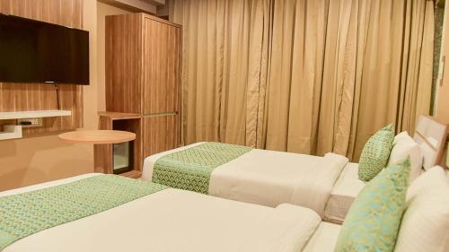 Imagen de la habitación del Hotel HOTEL APOLLO GRAND A UNIT OF SATYAM ASSOCIATES. Foto 18