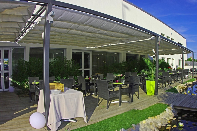 Imagen del bar/restaurante del Hotel HOTEL CAMPANILE MONTPELLIER OUEST - Croix d'Argent. Foto 8