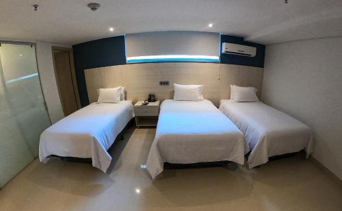 Imagen de la habitación del Hotel HOTEL MANZUR. Foto 18