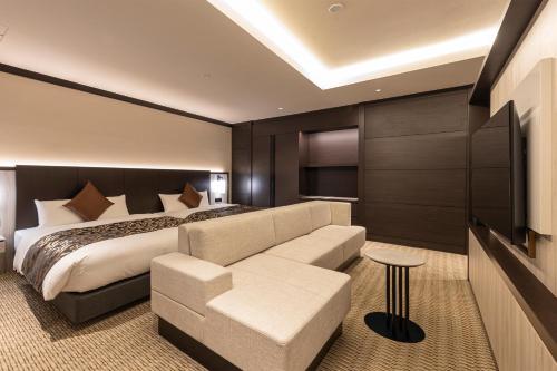Imagen de la habitación del Hotel HOTEL R9 Premium Ichikawaekimae. Foto 11