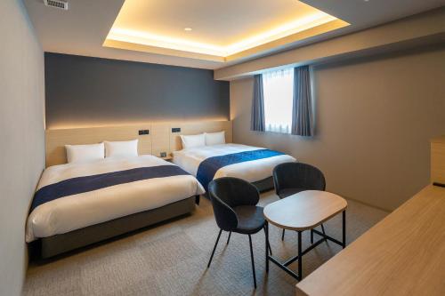 Imagen de la habitación del Hotel HOTEL R9 Premium Ichikawaekimae. Foto 12