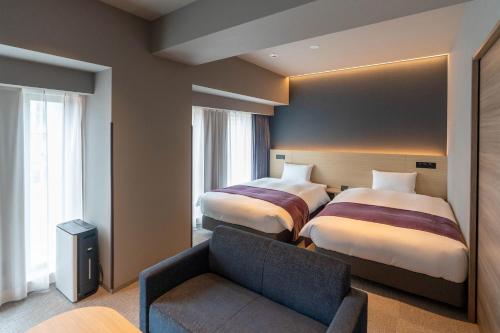 Imagen de la habitación del Hotel HOTEL R9 Premium Ichikawaekimae. Foto 13