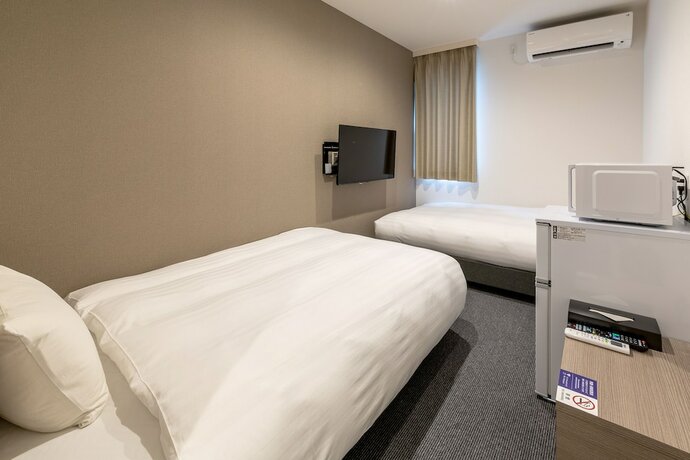 Imagen de la habitación del Hotel HOTEL R9 The Yard Asahishiro. Foto 17