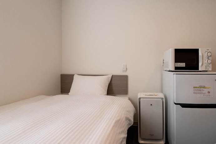 Imagen de la habitación del Hotel HOTEL R9 The Yard Honjo. Foto 18