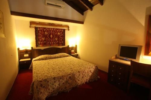 Imagen de la habitación del Hotel HOTEL SPA MONTANA. Foto 17