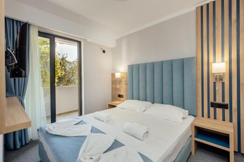 Imagen de la habitación del Hotel HOTEL TALIA. Foto 20