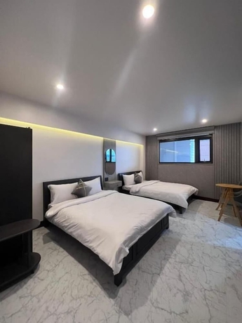 Imagen de la habitación del Hotel HT House. Foto 8