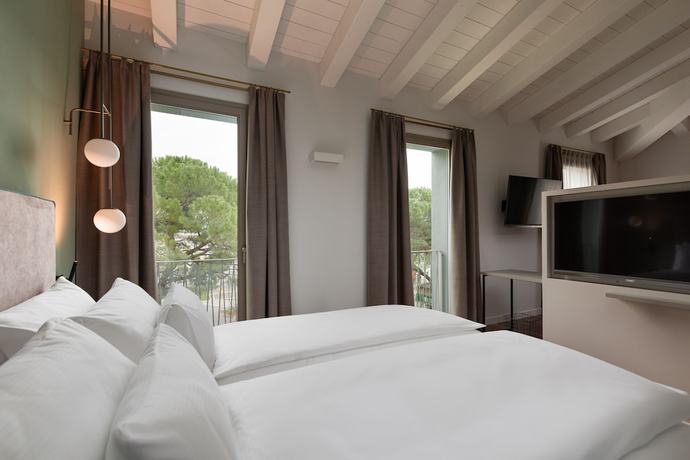 Imagen de la habitación del Hotel HT Trieste. Foto 6