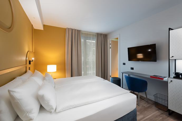 Imagen de la habitación del Hotel HT Trieste. Foto 13