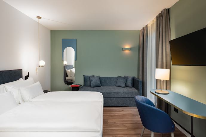 Imagen de la habitación del Hotel HT Trieste. Foto 14