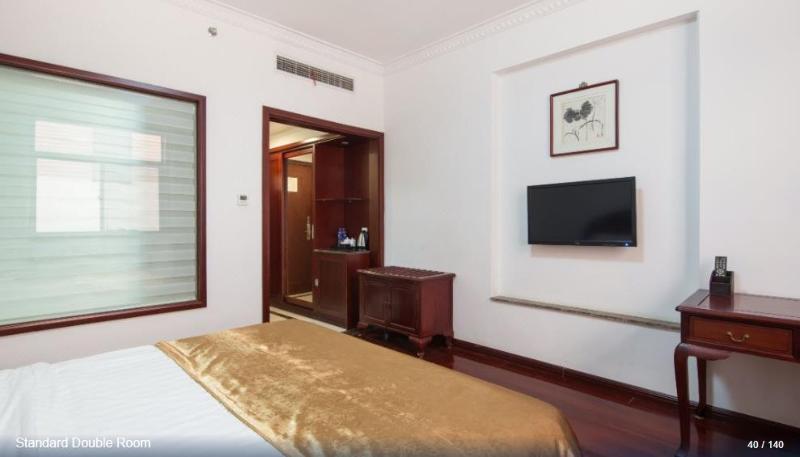 Imagen de la habitación del Hotel HUAJIANG HOTEL. Foto 3
