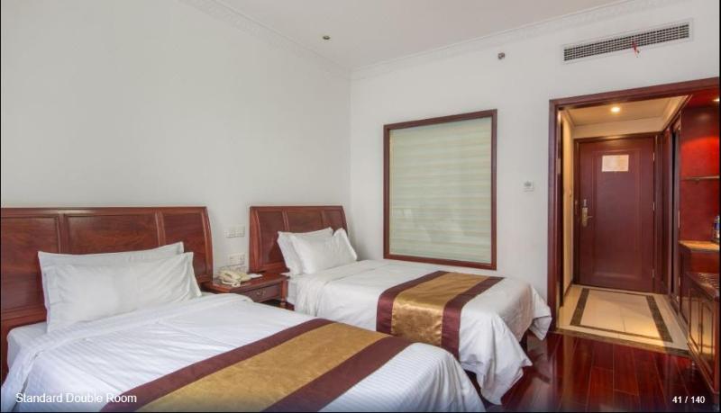 Imagen de la habitación del Hotel HUAJIANG HOTEL. Foto 4