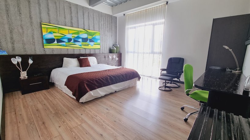 Imagen de la habitación del Hotel Habitat Suites. Foto 7