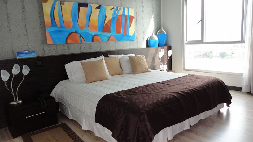 Imagen de la habitación del Hotel Habitat Suites. Foto 11