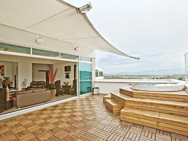 Imagen de la habitación del Hotel Habitat Suites. Foto 14