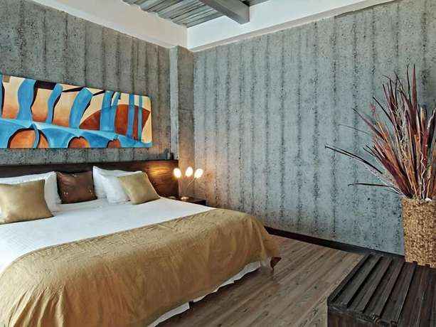 Imagen de la habitación del Hotel Habitat Suites. Foto 17