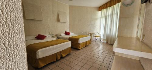 Imagen de la habitación del Hotel Hacienda del Rio Oaxtepec. Foto 12