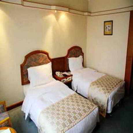 Imagen de la habitación del Hotel Hai Tian Qingdao. Foto 5