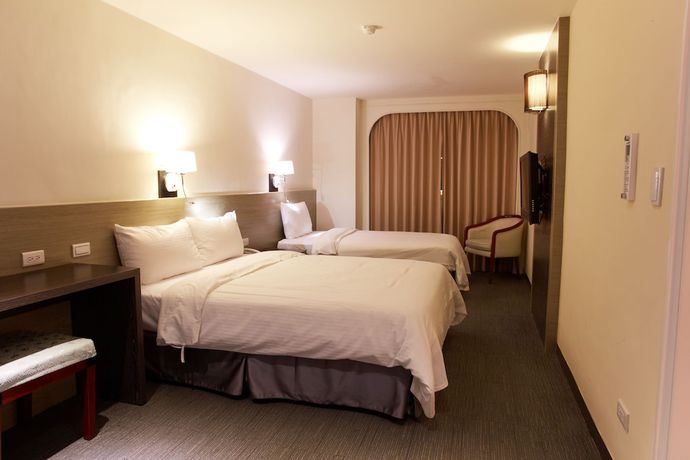 Imagen de la habitación del Hotel Haifu Garden. Foto 9