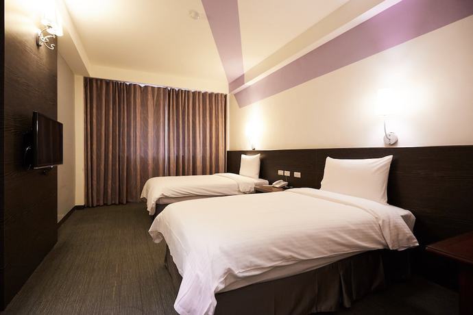 Imagen de la habitación del Hotel Haifu Garden. Foto 13