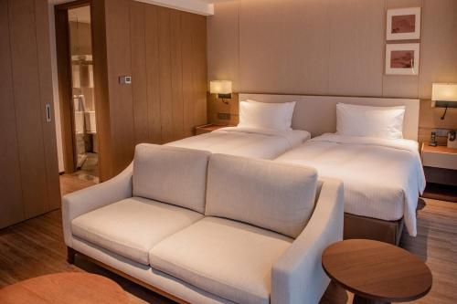 Imagen de la habitación del Hotel Haikou Hongyuan by The Crest Collection. Foto 12