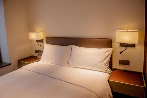 Imagen de la habitación del Hotel Haikou Hongyuan by The Crest Collection. Foto 13