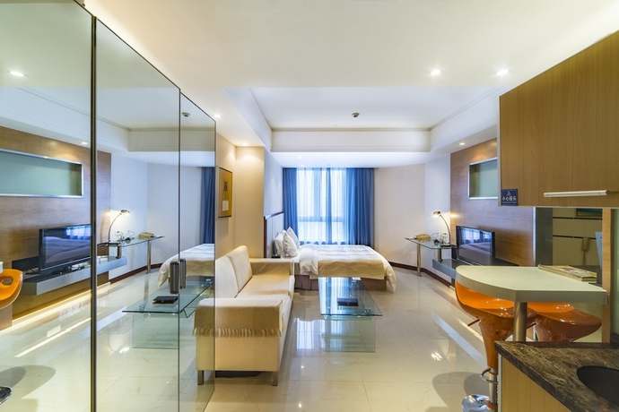 Imagen de la habitación del Hotel Haikou Mingguang Shengyi. Foto 11
