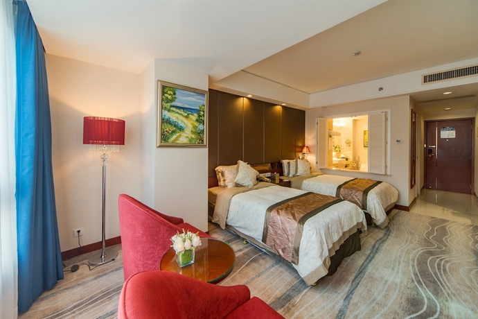 Imagen de la habitación del Hotel Haikou Mingguang Shengyi. Foto 12