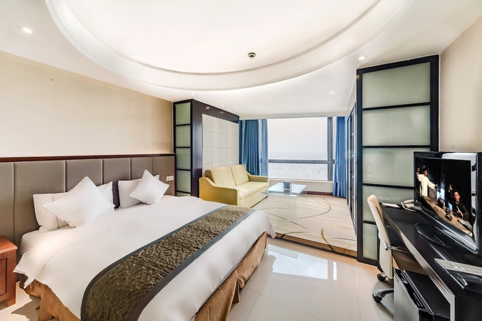 Imagen de la habitación del Hotel Haikou Mingguang Shengyi. Foto 15
