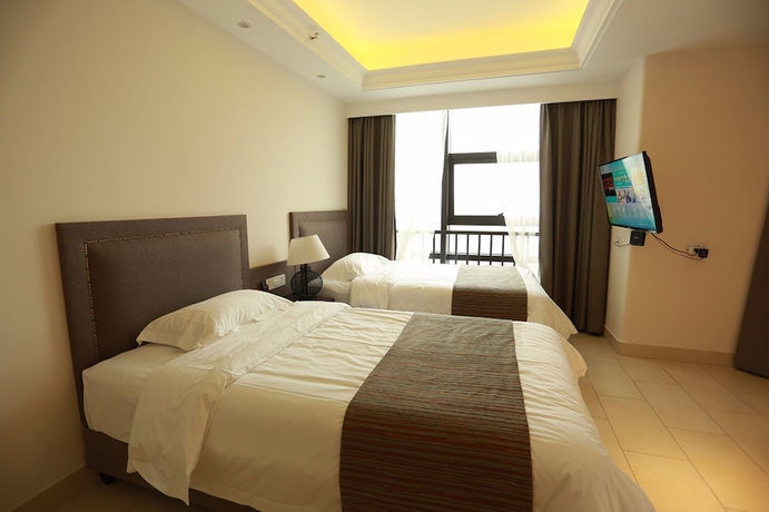 Imagen de la habitación del Hotel Haikou Tianyi International. Foto 2