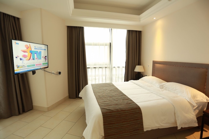 Imagen de la habitación del Hotel Haikou Tianyi International. Foto 10