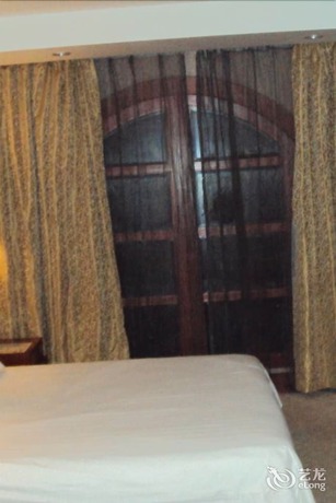 Imagen de la habitación del Hotel Haina Baichuan Hotel. Foto 14