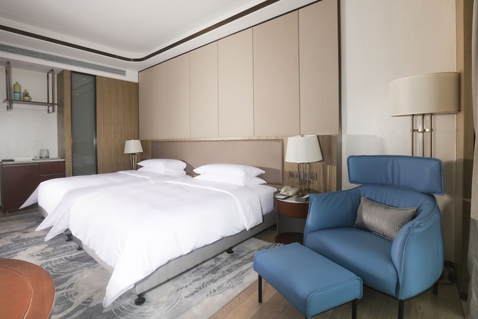 Imagen de la habitación del Hotel Hainan Blue Horizon Jun Hua. Foto 11