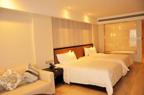 Imagen de la habitación del Hotel Hainan Greentown Blue Bay Resort，. Foto 1