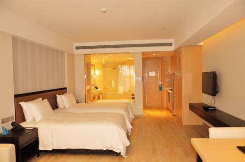 Imagen de la habitación del Hotel Hainan Greentown Blue Bay Resort，. Foto 3