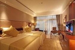 Imagen de la habitación del Hotel Hainan Guest House. Foto 3