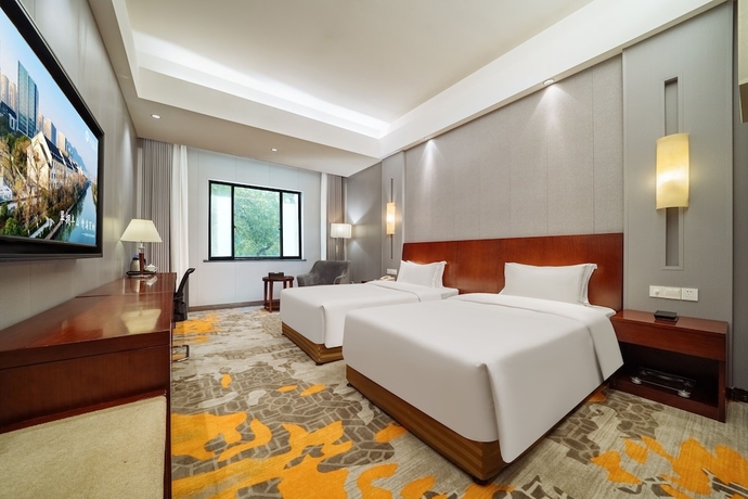 Imagen de la habitación del Hotel Haiwaihai Baina Hotel. Foto 8