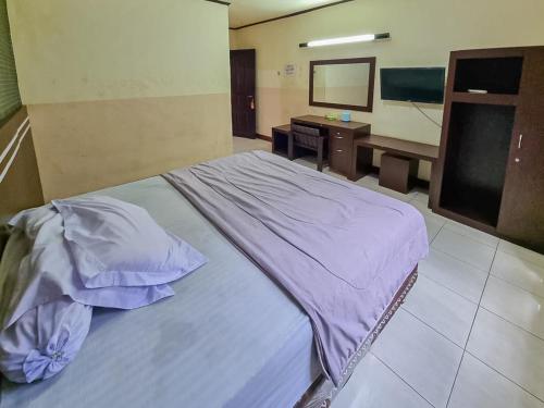 Imagen de la habitación del Hotel Halmahera Palangkaraya Redpartner. Foto 9