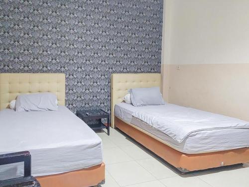 Imagen de la habitación del Hotel Halmahera Palangkaraya Redpartner. Foto 13