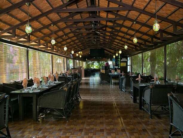 Imagen del bar/restaurante del Hotel Hampi International. Foto 10