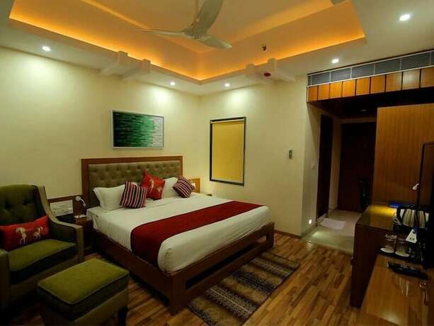 Imagen de la habitación del Hotel Hampi International. Foto 12