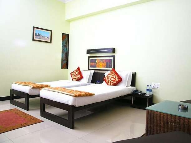 Imagen de la habitación del Hotel Hampi International. Foto 14