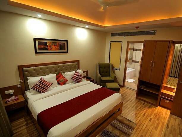 Imagen de la habitación del Hotel Hampi International. Foto 15