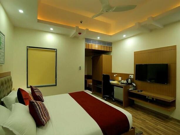 Imagen de la habitación del Hotel Hampi International. Foto 16
